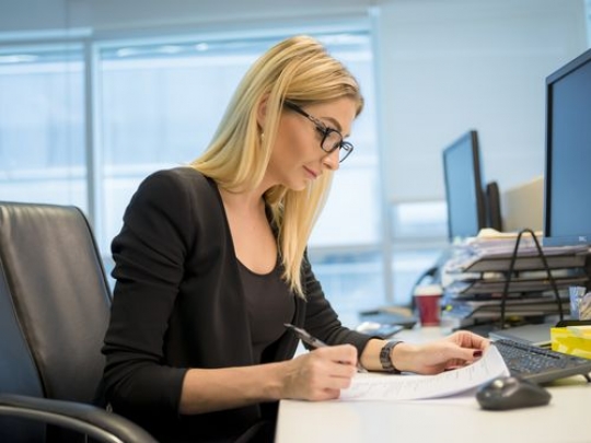 Western business woman at the office working|
