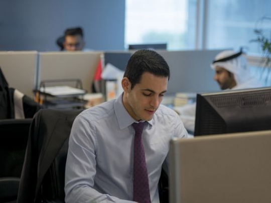 Businessman sitting at his desk working|