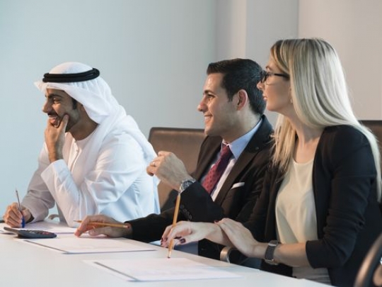 Colleagues during an update meeting|-