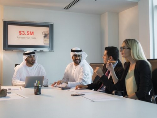 Business people during an update meeting at the office|-