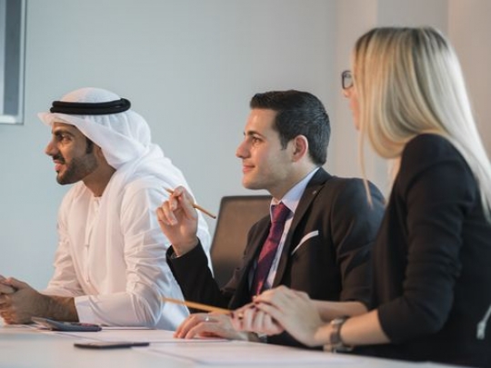 Arab business men and western woman during a meeting|-