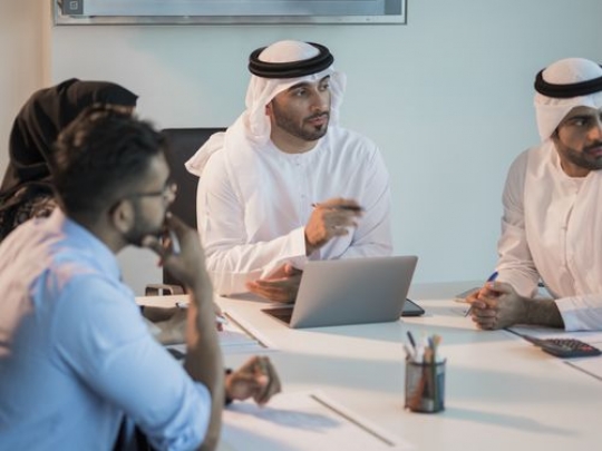 Employees talking during a meeting|-