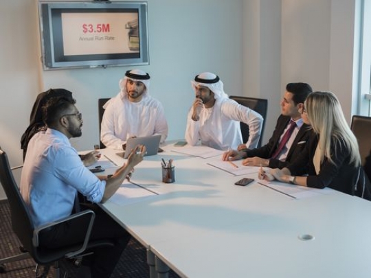 Colleagues during a meeting in a conference room|-