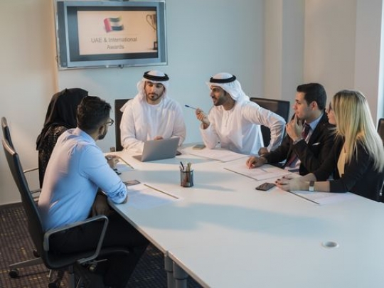 Business men and business women during a meeting at the conference room|-