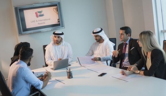 Business men and business women during a meeting|-