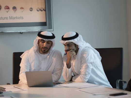 Two arab colleagues during a meeting at the office|-