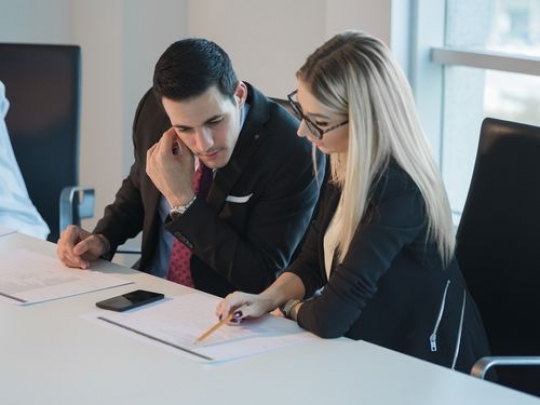 Colleagues during a meeting at the office|-