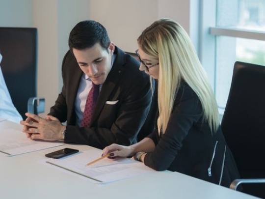 Colleagues talking during a meeting at the office|-