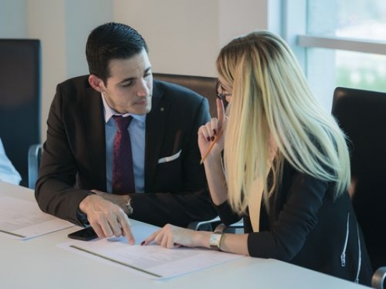 Business people talking about work during a meeting|-