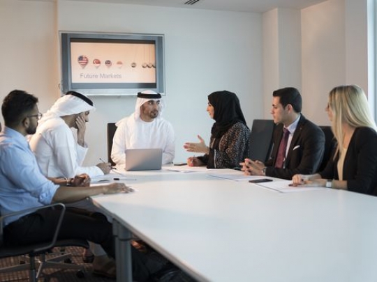 Side view of a employees during a meeting at the office|-