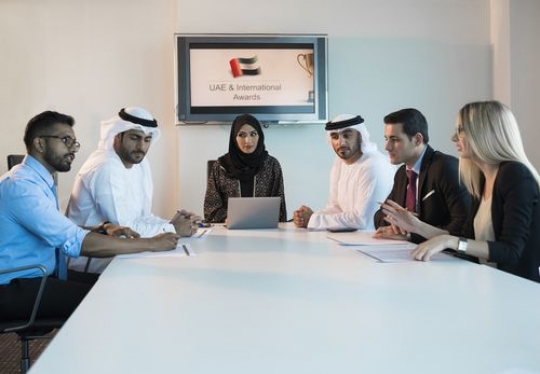 Employees having an office meeting|-