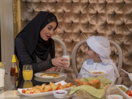Arab mother talking to her son|-