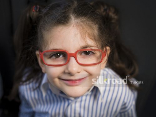 Close up of a Middle Eastern student wearing glasses|-