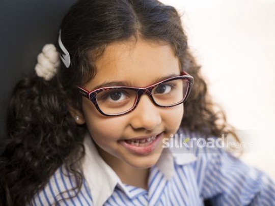 Middle Eastern student dressed in a school uniform|-