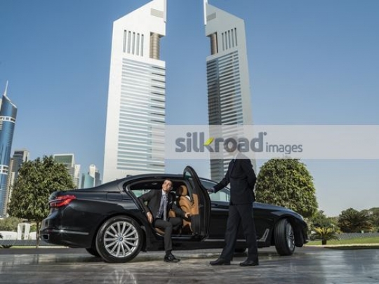 Arab Businessman getting out of the car|
