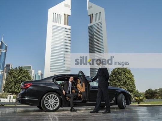 Young Arab Businessman getting out of the car|