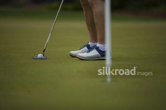 A man is playing golf