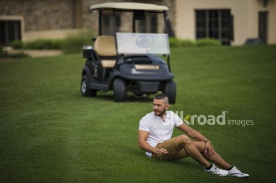 Arab man sitting and looking around |-