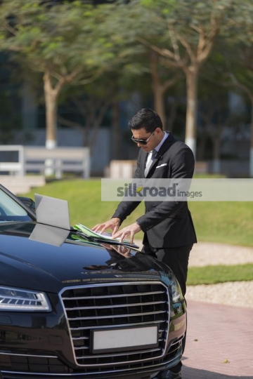 Arab Businessman working outside|