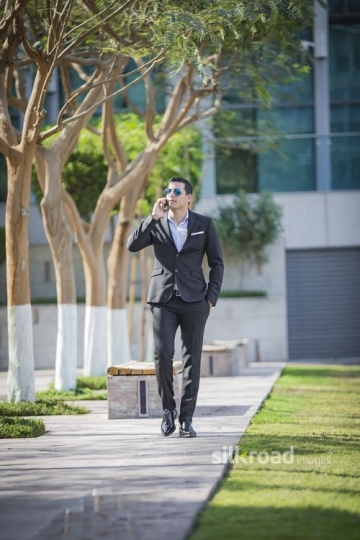 Middle Eastern Businessman walking |-