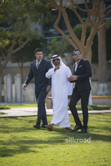 Middle Eastern Businessman talking to his colleagues|-