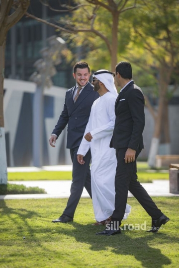 Group of Businessmen walking and laughing together|-