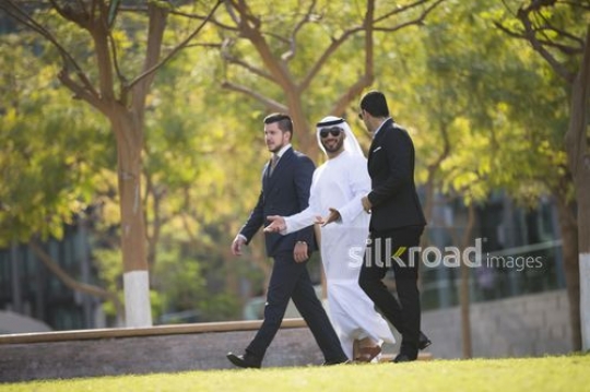 Group of Businessmen walking all together|-