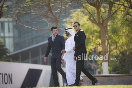 A group of Businessmen walking together|-