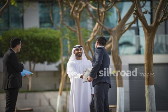 Middle Eastern Businessman shaking hands with his employee|-