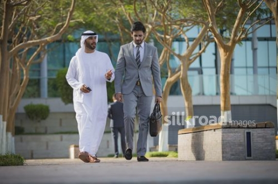 Two Businessmen walking together|-