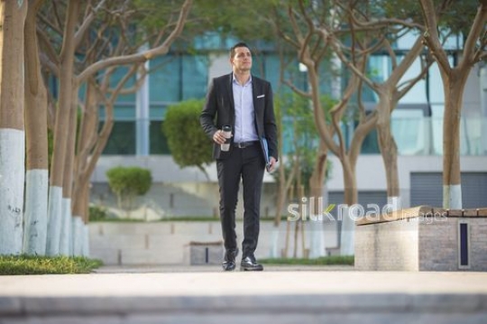 Arab businessman walking|-