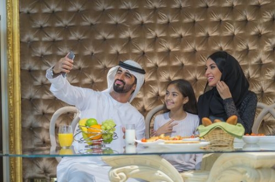 Arabian family taking a photo together|-