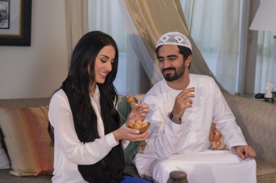 Arabian father and mother sitting together|-