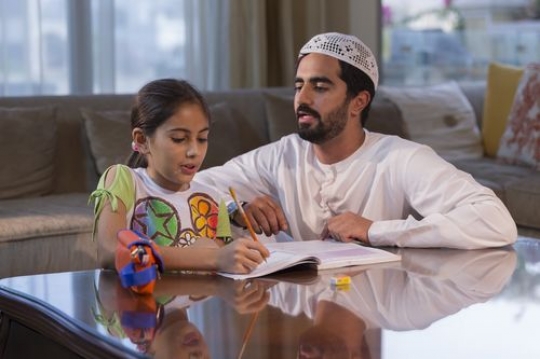 Arab daughter and father studying|-