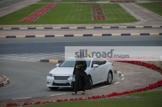Middle Eastern Businesswoman walking|