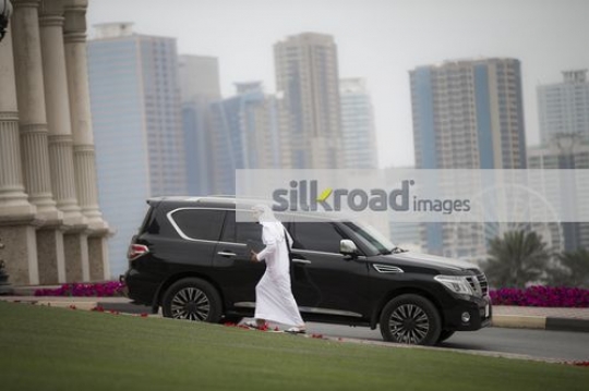 Businessman dressed in the traditional attire walking to the office|