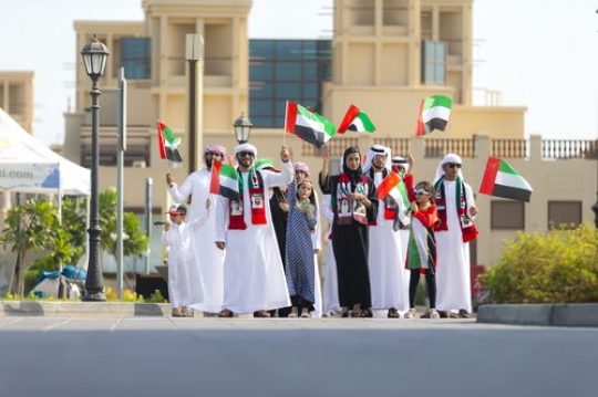 Arab family celebrating National Day|