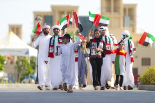 Family and friends in the UAE traditional attire celebrating National Day|