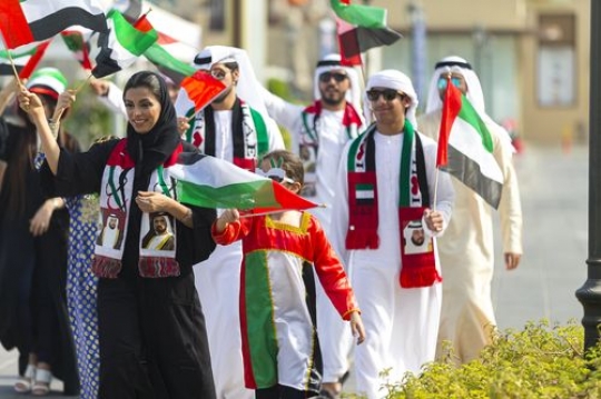 Family and kids celebrating the UAE National Day|