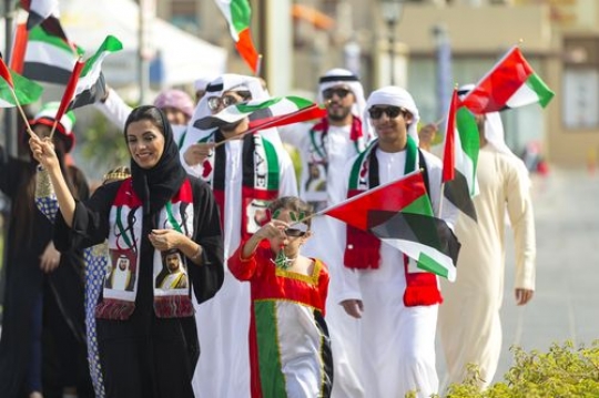 A group of family and friends during a National Day parade|