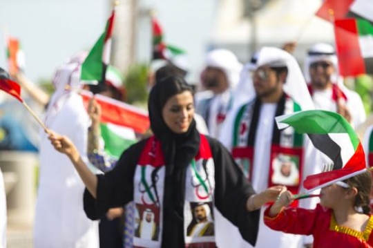 Arab woman and child celebrating National Day|