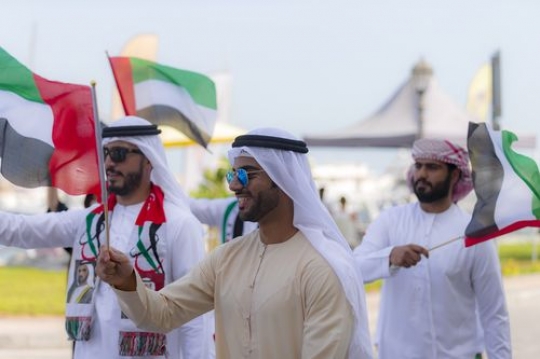 Arab men dressed in the traditional attire representing their country|