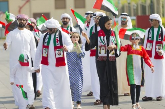 Arabian family and friends celebrating the UAE National Day|