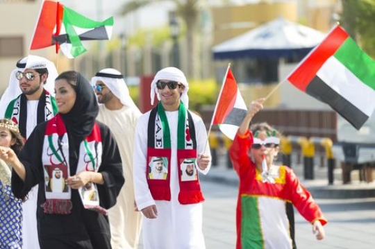 Family dressed in the traditional attire celebrating UAE National Day|