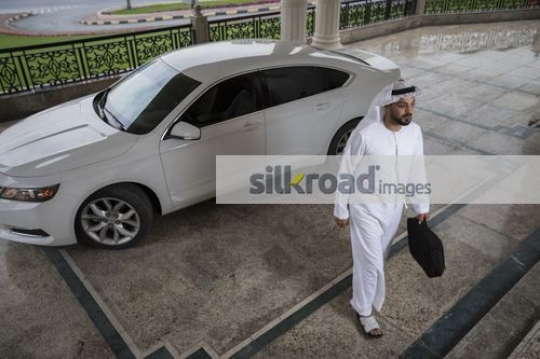 Middle Eastern Businessman walking|