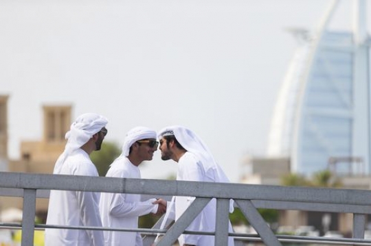Arab men saying hello in the UAE traditional way|
