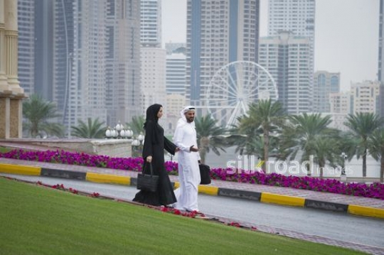 Businessman and business woman talking to each other|-