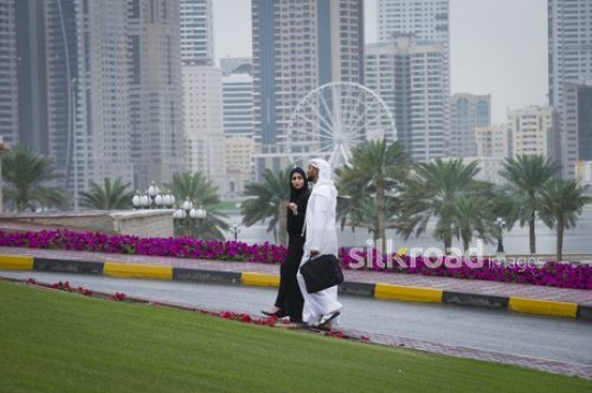 Two employees walking together to the office|-
