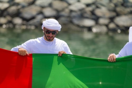 Arabian man dressed in the traditional work attire celebrating National Day|