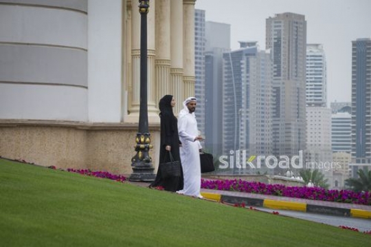 Middle Eastern business colleagues walking together|-